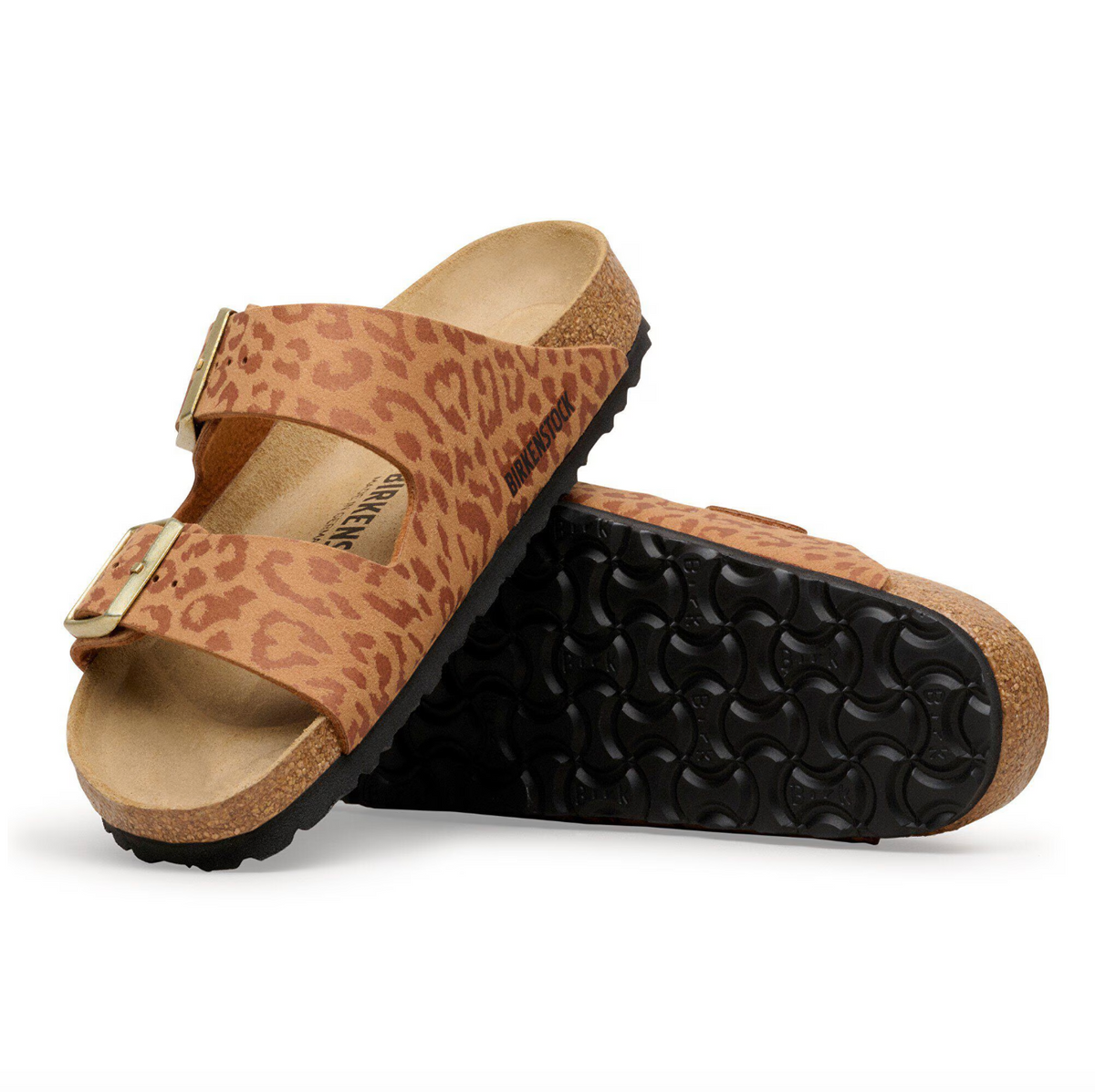 Pair of leopard print Birkenstock Arizona sandals with gold buckles on a white background