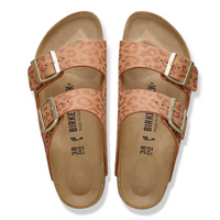 Pair of leopard print Birkenstock Arizona sandals with gold buckles on a white background