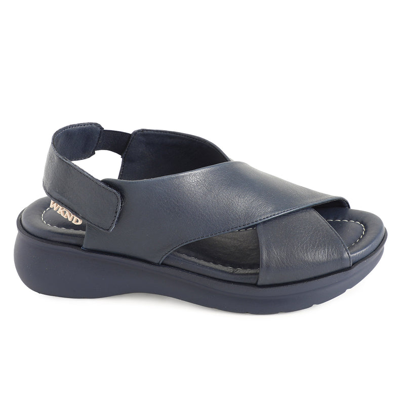 soft leather navy sandals with velcro fastening and cushioned navy slightly platformed sole. 