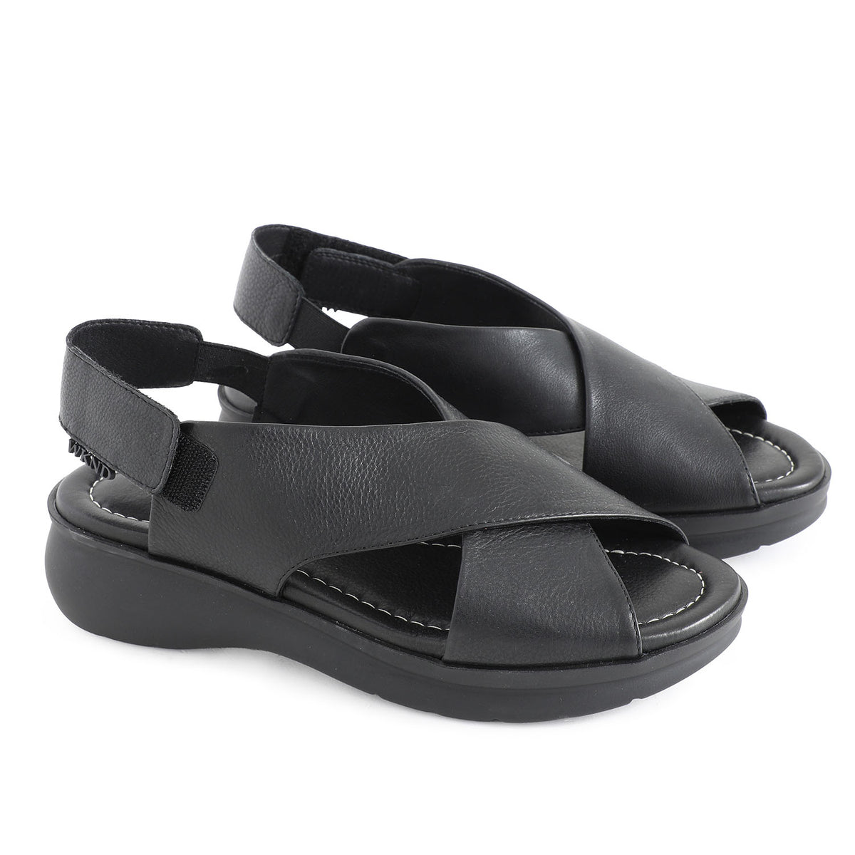 soft leather open toe black sandals with back strap with velcro closure on a cushioned small platform sole