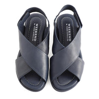 soft leather navy sandals with velcro fastening and cushioned navy slightly platformed sole. An overhead image