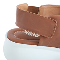soft leather tan sandals with velcro fastening and cushioned white sole