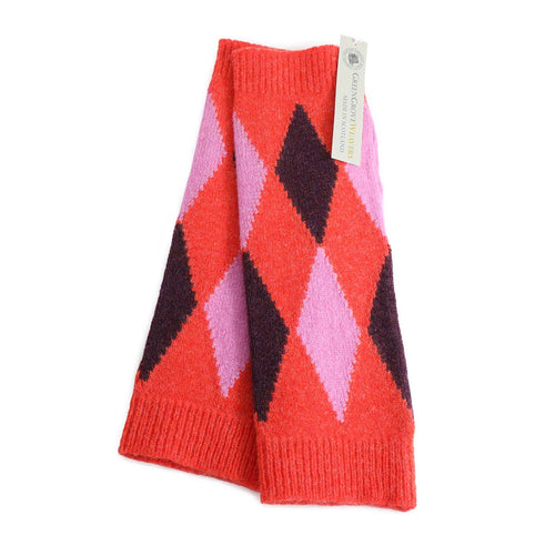 Pure wool wrist warmers in coral with diamond pattern in pink and damson made in Scotland by Green Grove Weavers and available at The Shoe Gallery