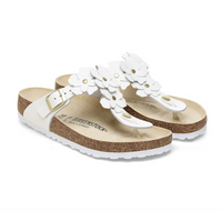 A pair of Birkenstock white leather flower embellished sandals with buckle closure