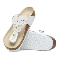 A pair of Birkenstock white leather flower embellished sandals with buckle closure