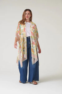 Model wears a One Hundred Stars Giant Kantha Throwover in lime with jeans