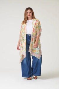 Model wears a One Hundred Stars Giant Kantha Throwover in lime with jeans