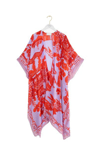 One Hundred Stars Giant Willow throwover in bright red and lilac on a hanger. Available at theshoegallery.co.uk
