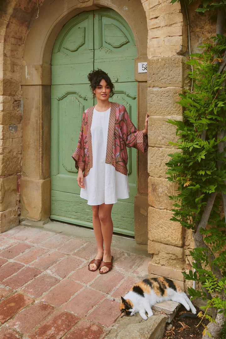 Model wears the Giant Kantha Dsk Kimono by One Hundred Stars available at The SHOE GALLERY over a white dress
