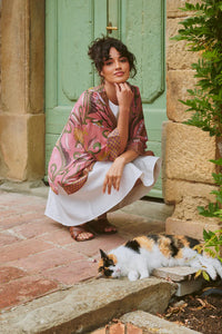 Model wears the Giant Kantha Dsk Kimono by One Hundred Stars available at The SHOE GALLERY over a white dress