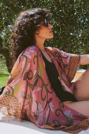 Model wears a One Hundred Stars Giant Kantha Throwover over a swimsuit