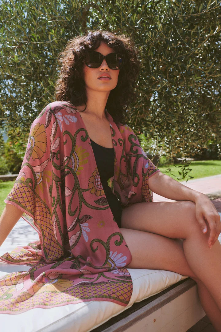 Model wears a One Hundred Stars Giant Kantha Throwover over a swimsuit