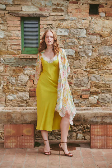 Model wears a One Hundred Stars Giant Kantha Throwover over a lime dress