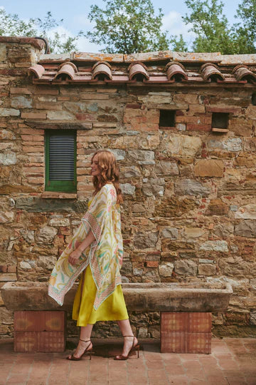 Model wears a One Hundred Stars Giant Kantha Throwover over a lime dress