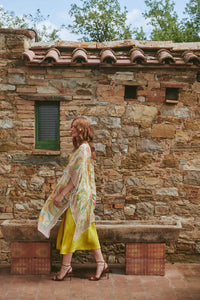 Model wears a One Hundred Stars Giant Kantha Throwover over a lime dress