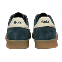 Gola teal blue suede trainer with cream-colored side stripe, cream lace, and gum sole. The brand name 'Gola' is printed on the side of the shoe and on the heel. Available at The Shoe Gallery