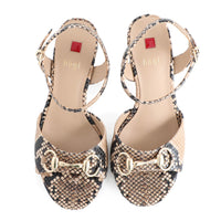 Pair of Hogl high-heeled sandals with snake print and gold accents on a white background