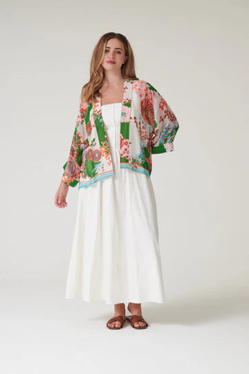 Model wears a One Hundred Stars Kitsch Bouquet Kimono over a white dress
