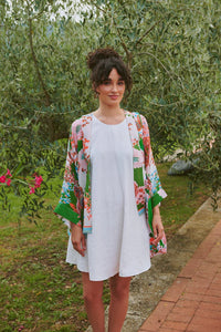 Model wears a One Hundred Stars Kitsch Bouquet Kimono over a white dress
