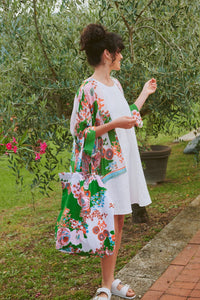 Model wears a One Hundred Stars Kitsch Bouquet Kimono over a white dress