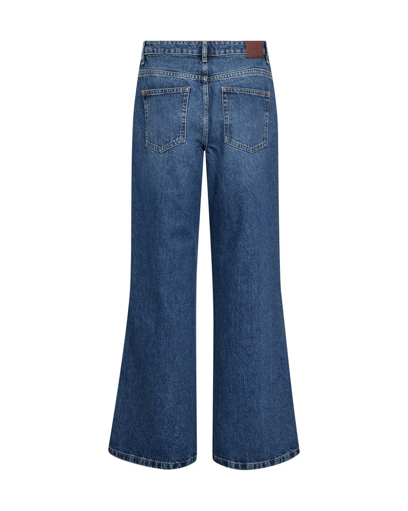 Back view of a pair of  Mos Mosh blue wide-leg denim jeans with a brown leather patch on the back waistband, shown on a plain white background.