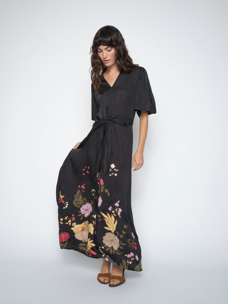 Woman wearing Black dress with floral printed hemline by Mos Mosh