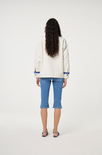 Fabienne Chapot cream Melodie jacket with double rick rack in blue and navy edging the collar, pockets, sleeves and central closure, back view