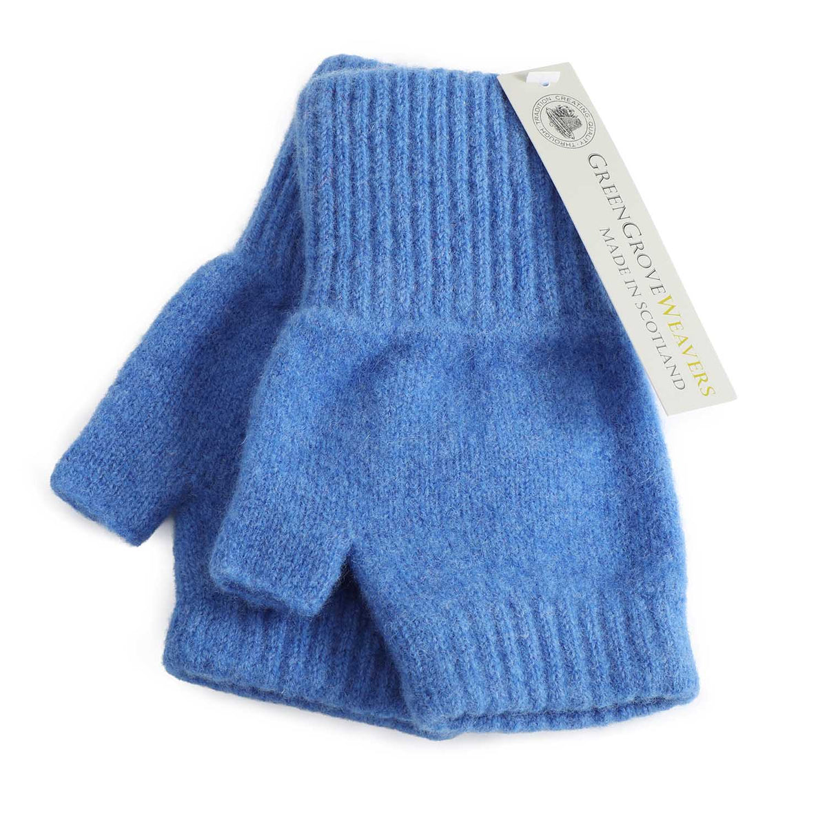 A pair of blue lambswool knit fingerless gloves with ribbed cuffs, shown with a white paper brand tag that reads 'Green Grove Weavers Made in Scotland'.