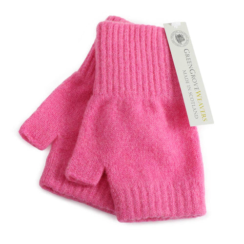 A pair of bubblegum pink lambswool knit fingerless gloves with ribbed cuffs, shown with a white paper brand tag that reads 'Green Grove Weavers Made in Scotland'.