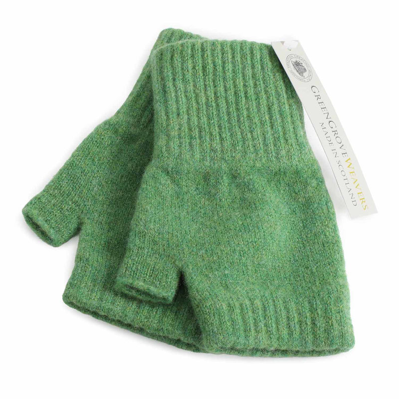 A pair of Meadow green lambswool knit fingerless gloves with ribbed cuffs, shown with a white paper brand tag that reads 'Green Grove Weavers Made in Scotland'.