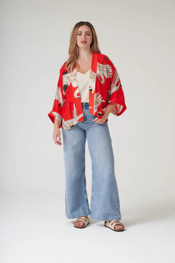 Model wears a One Hundred Stars Kimono in the crane print in scarlet