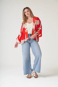 Model wears a One Hundred Stars Kimono in the crane print in scarlet