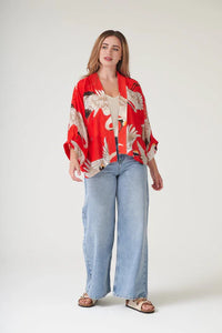 Model wears a One Hundred Stars Kimono in the crane print in scarlet