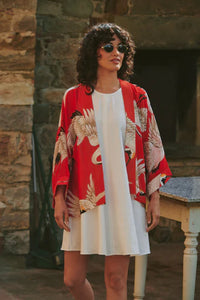 Model wears a One Hundred Stars Kimono in the crane print in scarlet