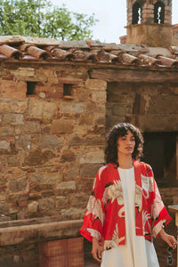Model wears a One Hundred Stars Kimono in the crane print in scarlet