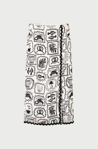 wrap style skirt in black and white tile pattern edged with black rick rack by Fabienne Chapot