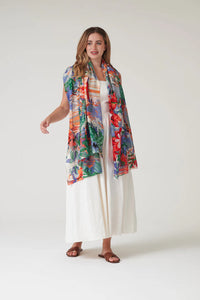 Model wears Tropicana Scarf by One Hundred Stars available at The SHOE GALLERY