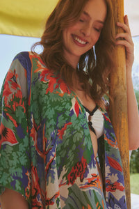 Model wears the Tropicana Blue Throwover by One Hundred Stars available at The SHOE GALLERY