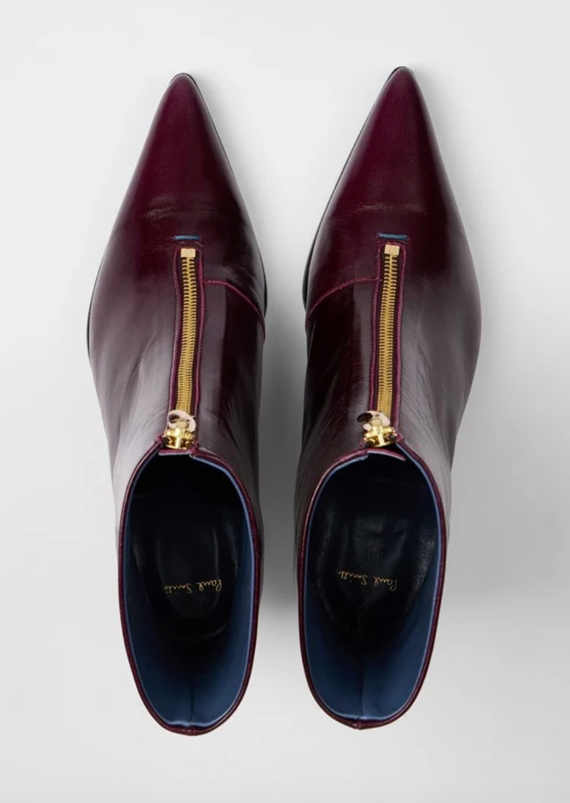 A pair of Paul Smith Winnie pointed-toe ankle boots in glossy burgundy leather with gold-tone side zippers and kitten heels, overhead view, available at The Shoe Gallery