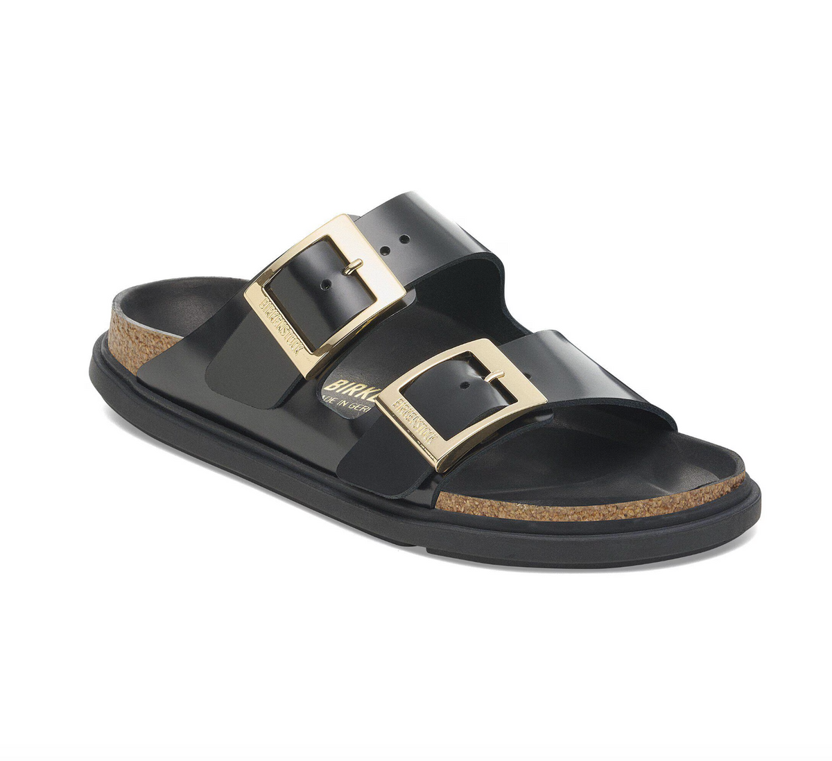 Black Birkenstock Arizona sandals with gold buckles and black bumper style soles