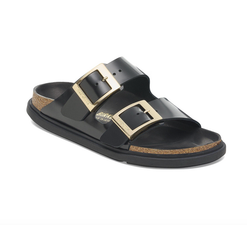 Black Birkenstock Arizona sandals with gold buckles and black bumper style soles