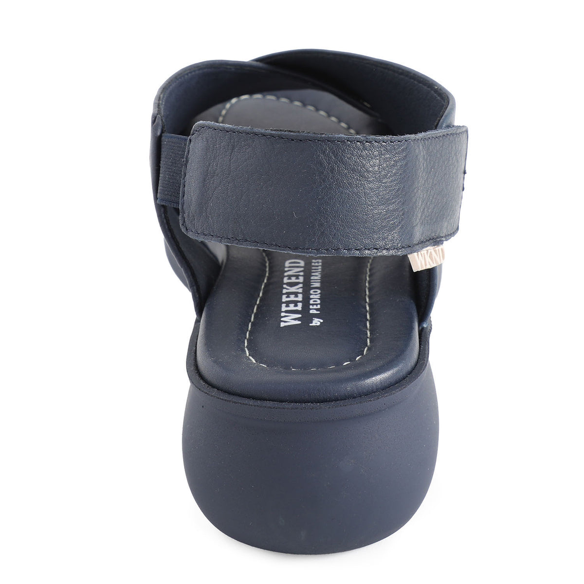 soft leather navy sandals with velcro fastening and cushioned navy slightly platformed sole. 