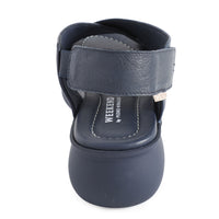 soft leather navy sandals with velcro fastening and cushioned navy slightly platformed sole. 