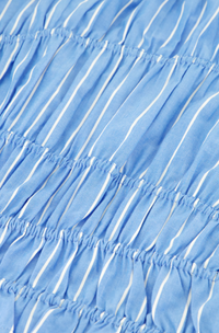 close up of blue ruched top by Fabienne Chapot