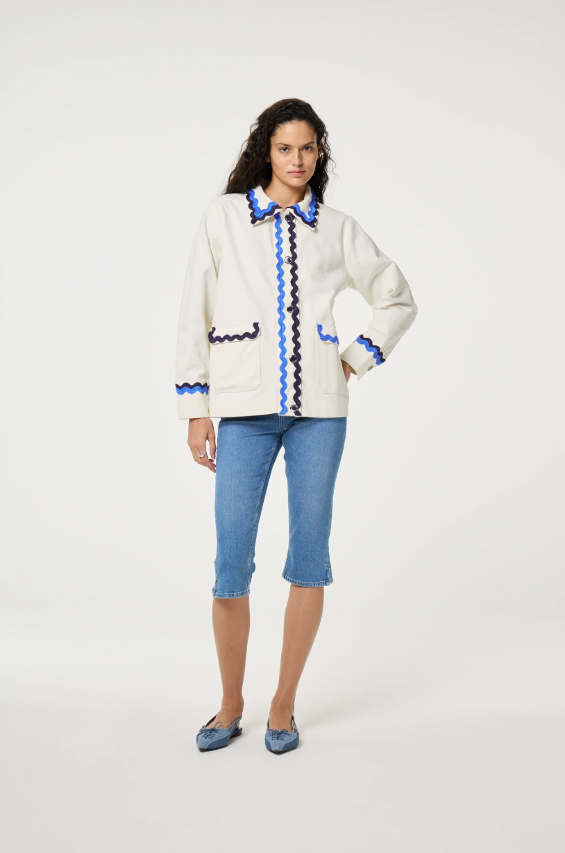 Fabienne Chapot cream Melodie jacket with double rick rack in blue and navy edging the collar, pockets, sleeves and central closure