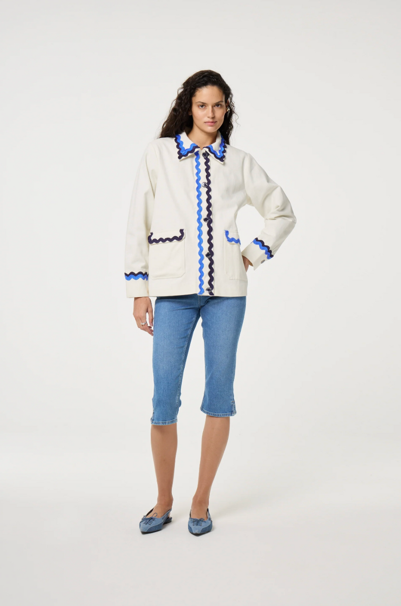 Fabienne Chapot cream Melodie jacket with double rick rack in blue and navy edging the collar, pockets, sleeves and central closure