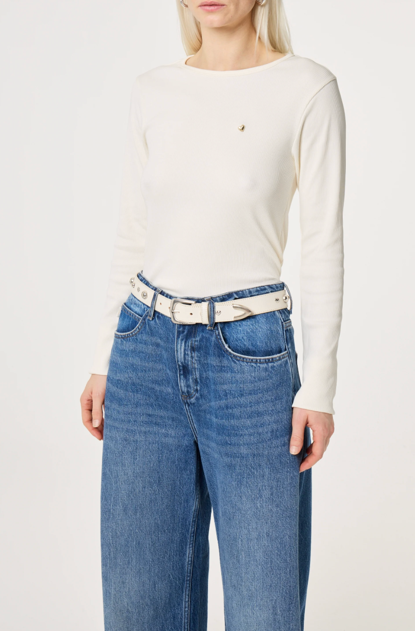 model wearing Beige belt with silver studs with silver buckle on denim jeans
