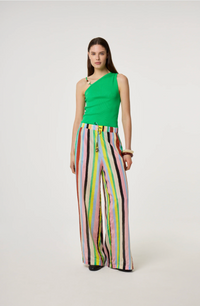 Model is wearing a green top and colorful Fabienne Chapot striped pants 
