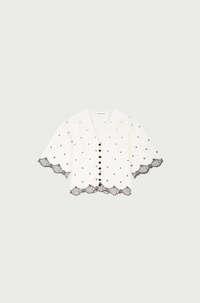 flat lay of Tylera blose showing embroidered detail and sleeve length