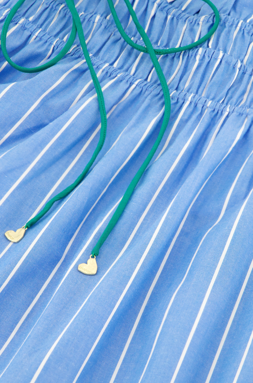 close up of green ties and ruching on the Fabienne Chapot skirt